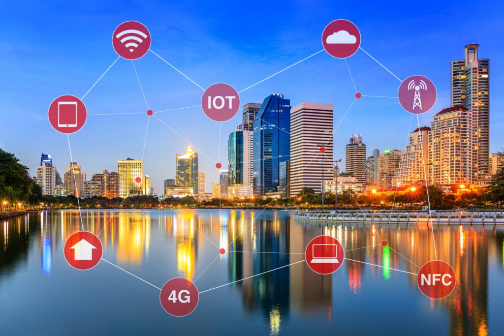 Smart City illustrated by Networking and Internet of Things or IOT and wireless signals